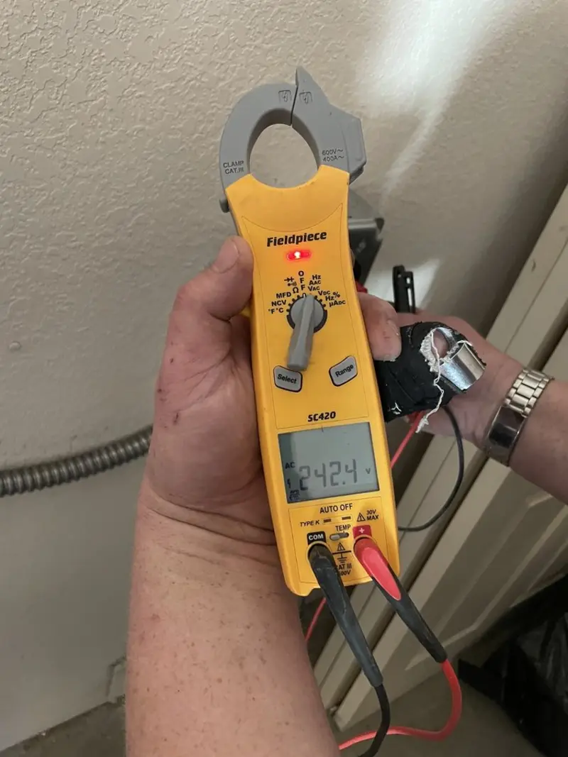 Voltage testing with clamp meter during Whole House Surge Protector in Westport